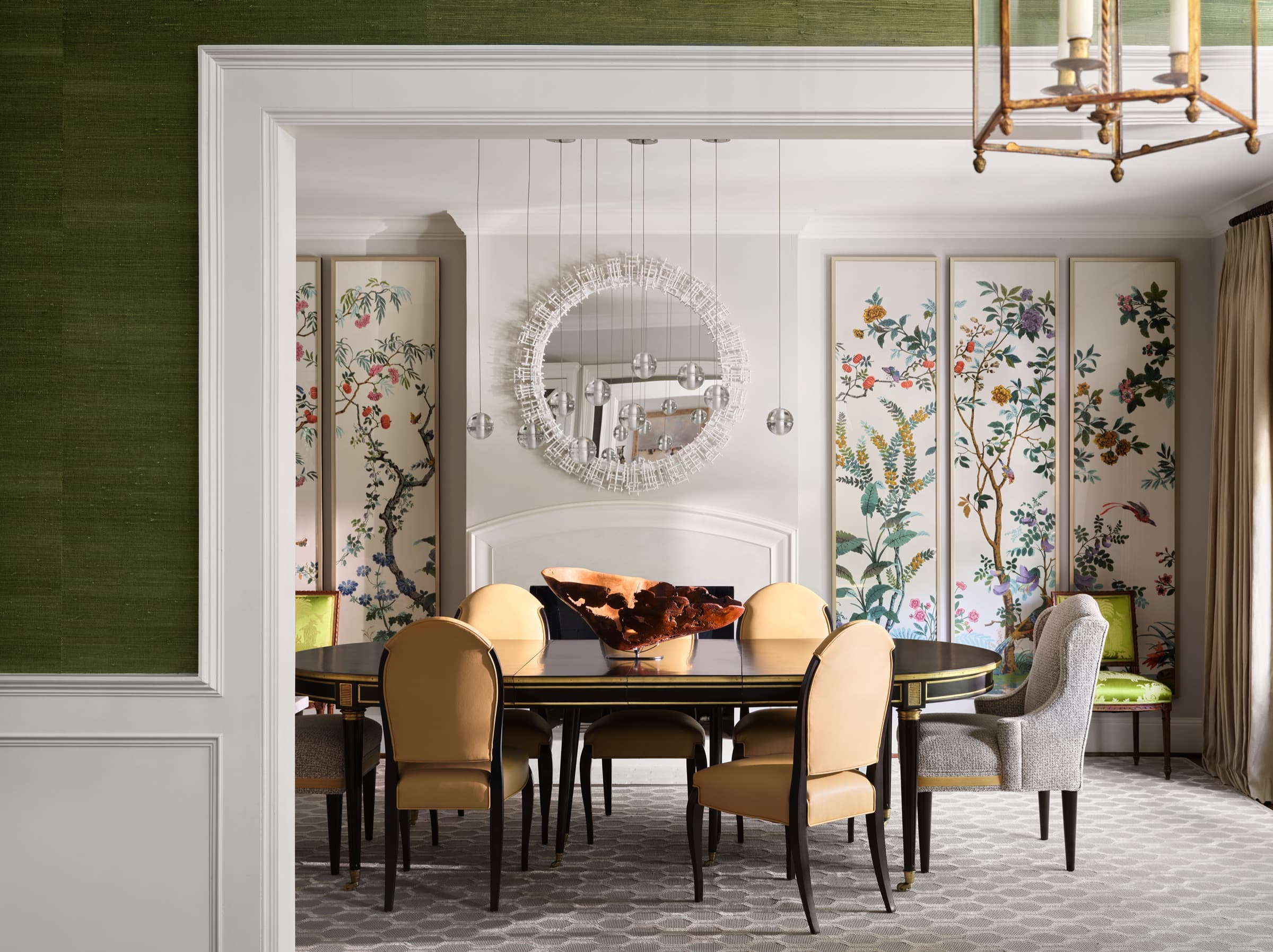The primary bedroom is layered with patterned textiles, tailored drapery, and softened color.