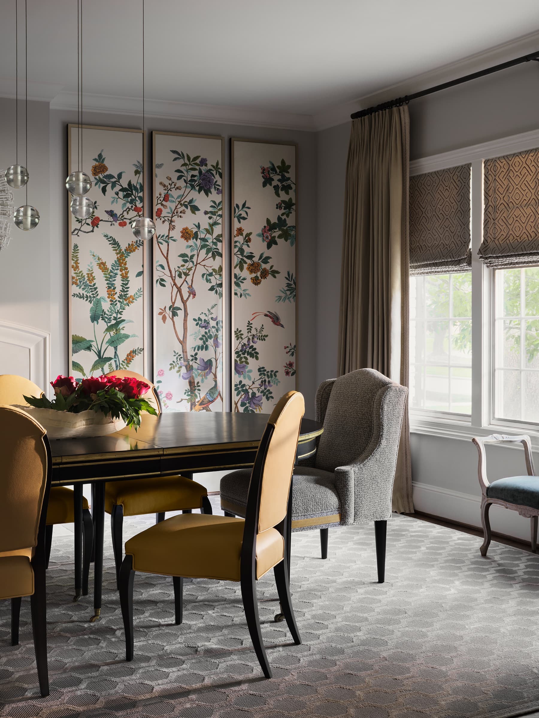 The family room uses texture, art, and warm upholstery to make the residence feel lived in.