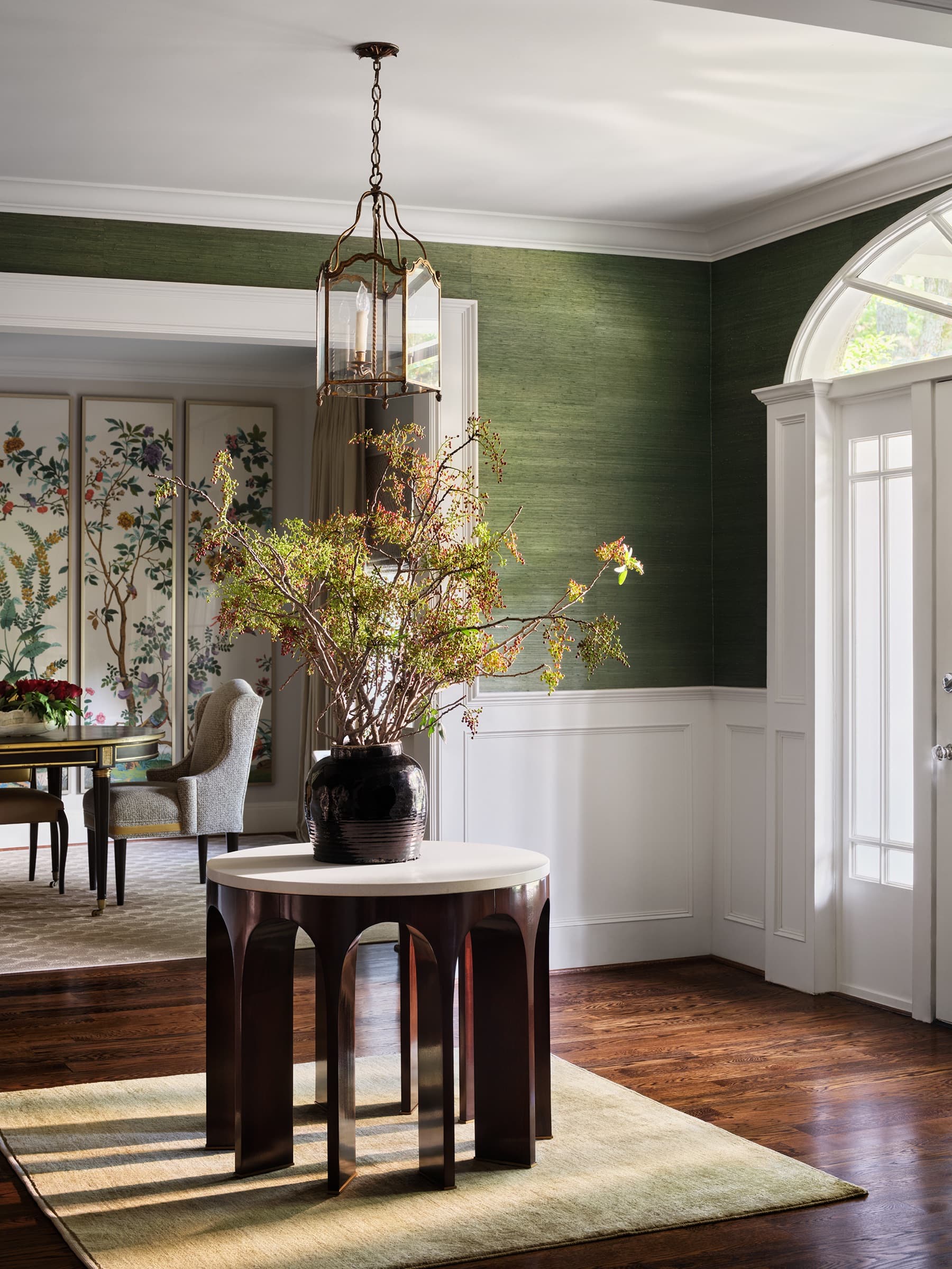 A sculptural floral moment gives the kitchen a collected, lived-in character.