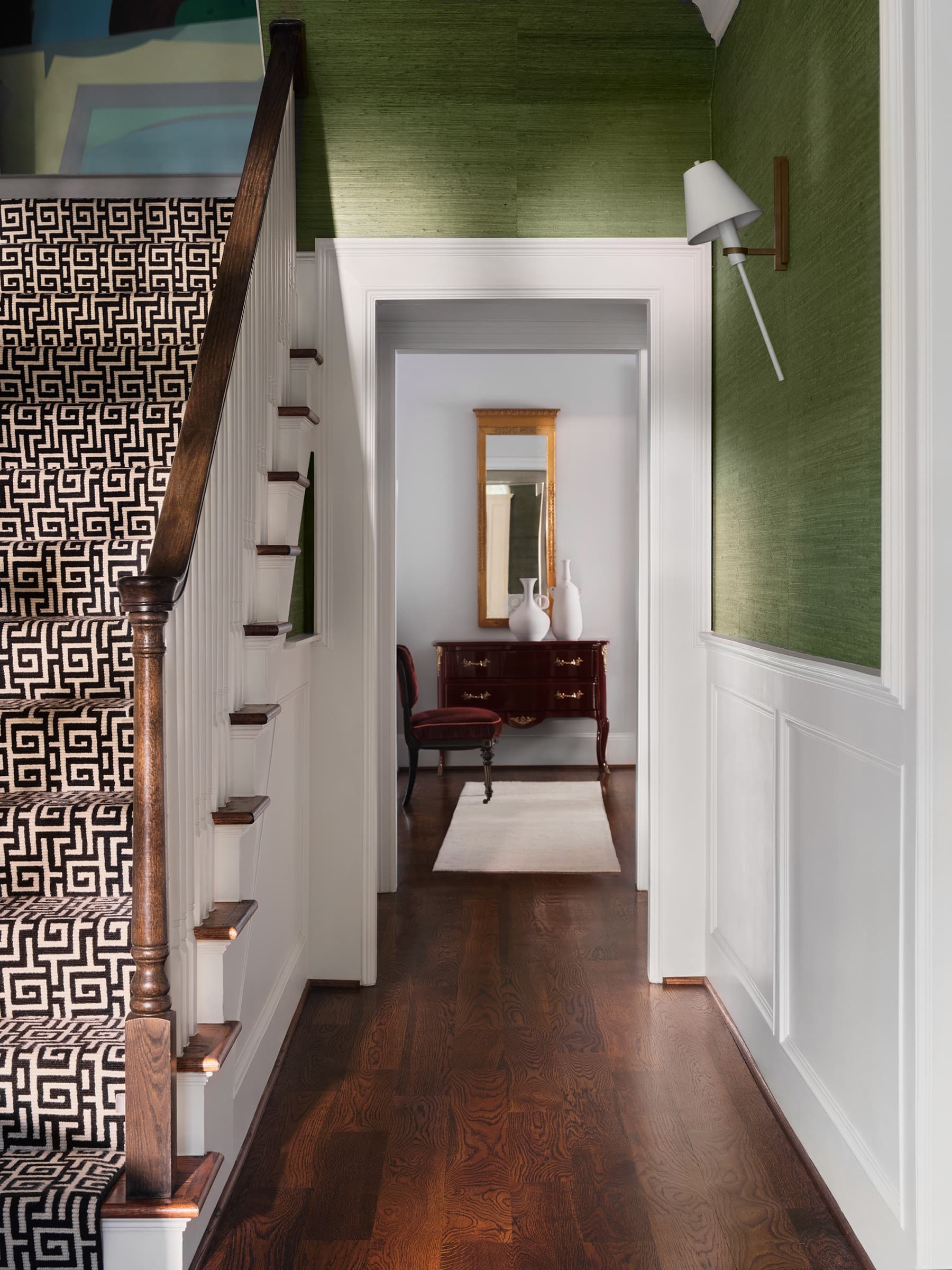 A breakfast area balances tailored upholstery, natural light, and a relaxed family rhythm.
