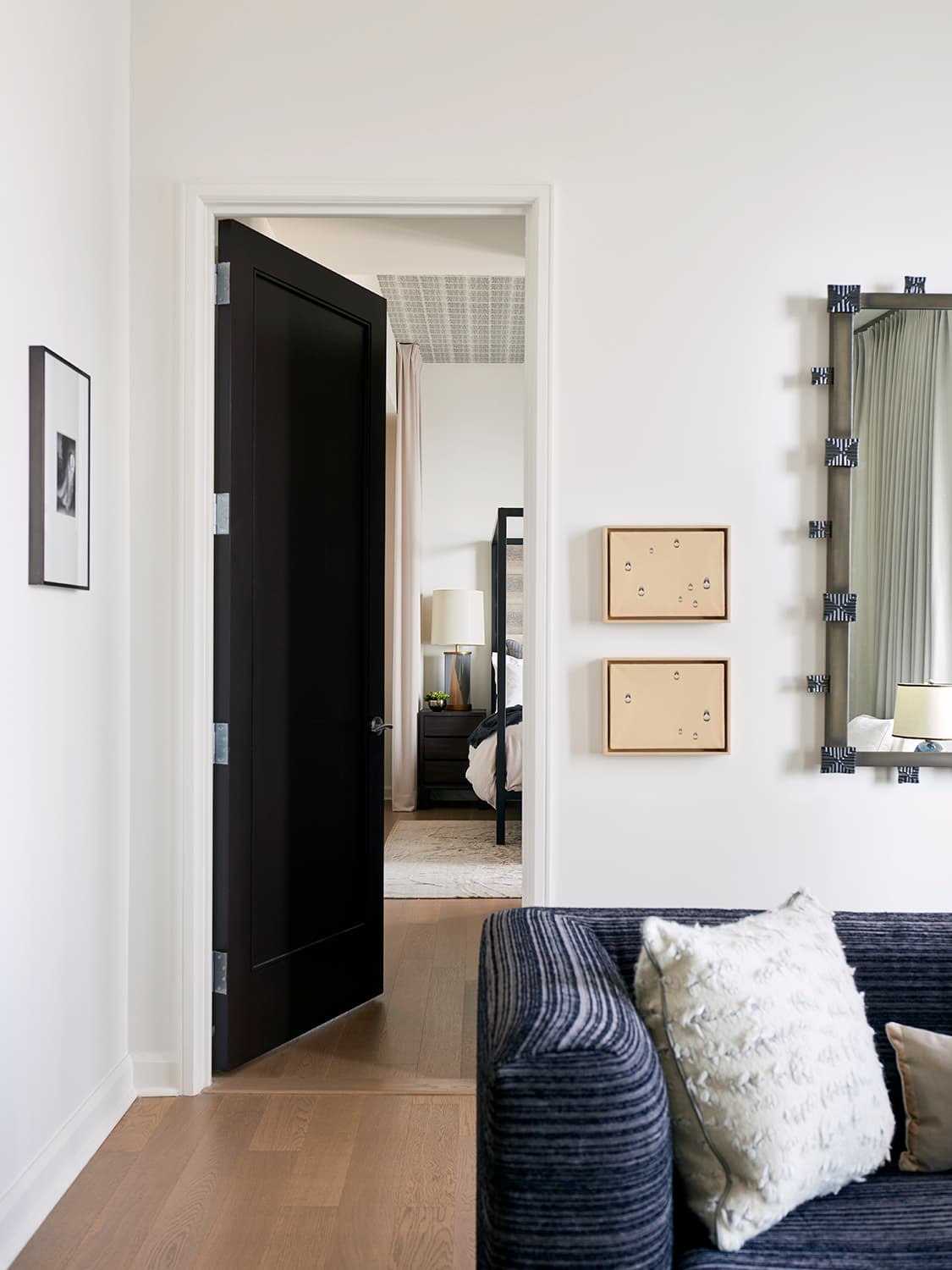 The bedroom uses color and custom bedding as precise, personal gestures.